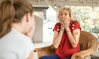 Close-up of an older woman with a wellness patch on her upper arm, supporting an easy daily wellness routine.