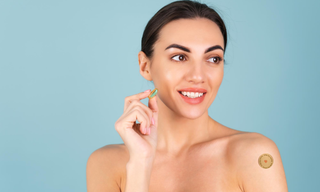 Woman showcasing a beauty and wellness routine with collagen supplements and a collagen patch, illustrating healthy skin, skincare habits, and modern beauty wellness practices.