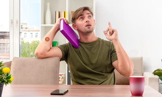 Man appearing mentally fatigued and searching for focus, representing low energy levels, productivity challenges, and the need for healthy lifestyle habits.