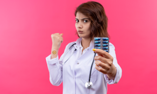 Woman holding pills while showing a patch on her arm, highlighting the comparison between transdermal patches and tablets for absorption.