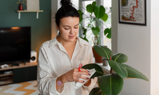 Woman using wellness patch at home, representing plant-based mood support and stress relief alternatives to stimulants