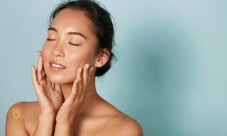 Woman with glowing skin highlighting natural ways to improve dull, tired-looking skin through hydration and collagen support.